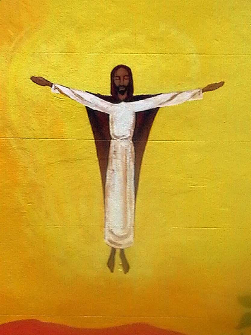 Mural of Christ ascending to heaven on a graffiti wall in Bristol, England.