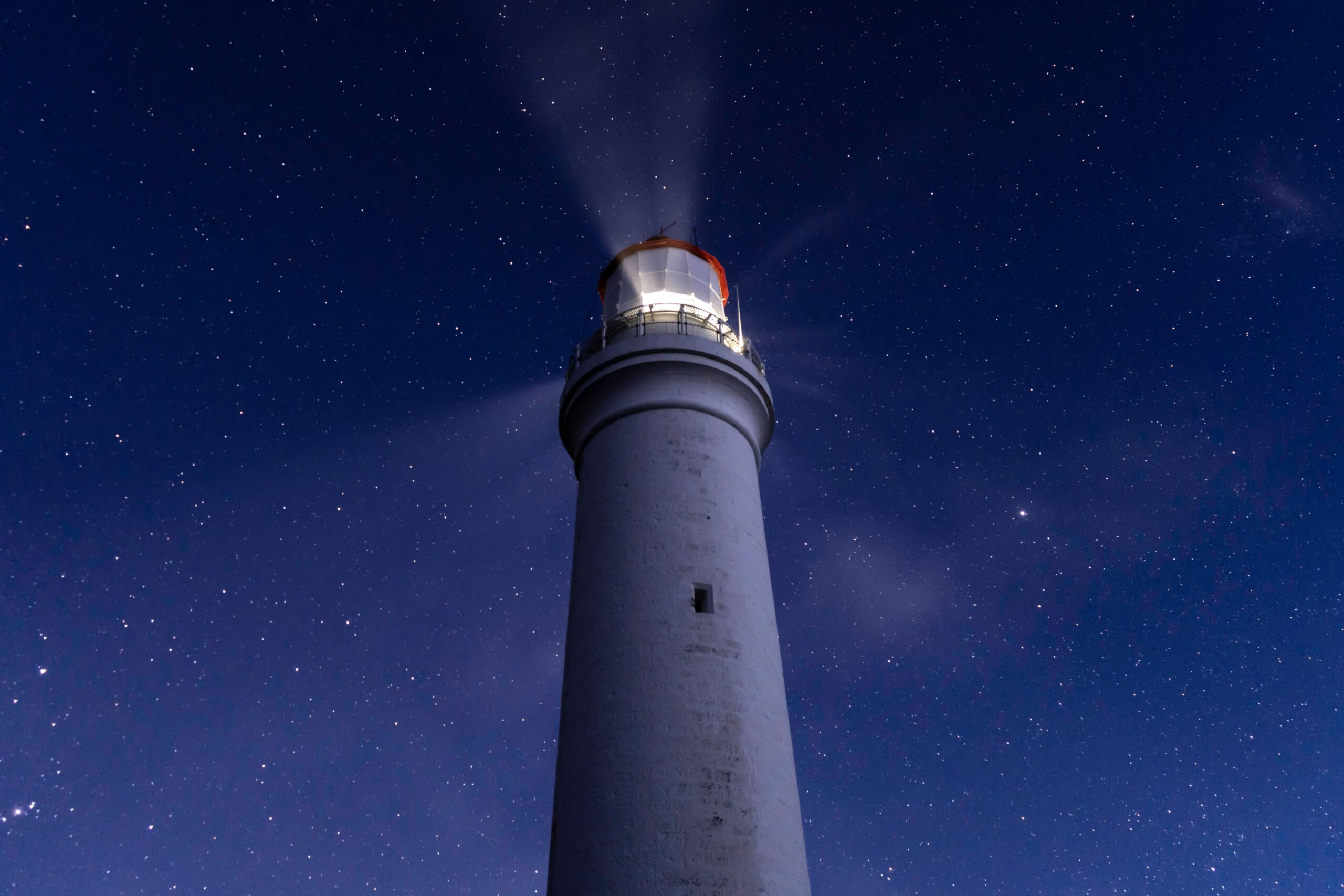 a lighthouse against the night sky